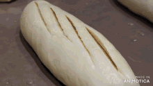 a loaf of bread is sitting on a table with the words made in animatica below it