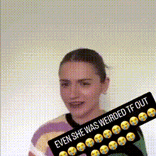 a woman holding a sign that says `` even she was weirded tf out '' .