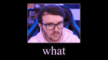 a man wearing glasses and headphones is sitting in a chair with the word what on the bottom .