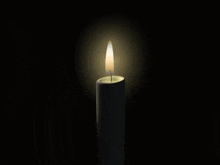 a candle with a picture of a person on it