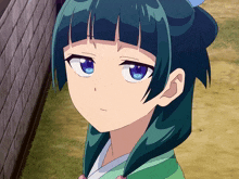 a girl with green hair and blue eyes is standing in front of a wall