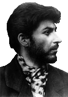 a man with a beard and a plaid scarf around his neck