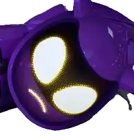 a close up of a purple object with a yellow eye