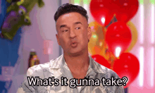 a man in a hawaiian shirt says what 's it gunna take