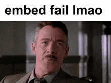 a man in a suit and tie with the words embed fail imao