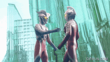 a gif from gifrun.com shows two superheros holding hands