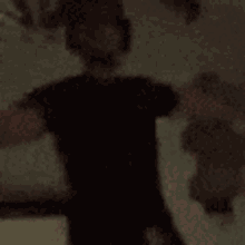 a blurry picture of a person in a dark room