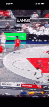 a basketball game is being played in a stadium with a sign that says bang on it .