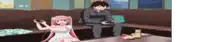 a man and a girl are playing video games on a couch .