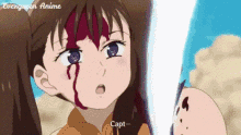 a close up of a girl with blood on her face and the words capt written on the bottom .