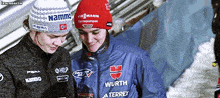 a woman wearing a wurth jacket looks at a cell phone