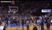 a basketball game is underway and the score is 24