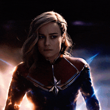 a woman in a red and blue superhero costume