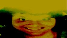 a close up of a person 's face with a yellow and green background