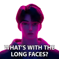 a man with purple hair is asking what 's with the long faces .