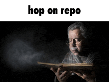 a man reading a book with the words hop on repo written above him