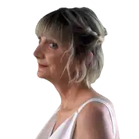 a woman in a white dress has a braided hairstyle on her head