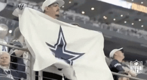 a man is holding a white flag with a star on it .
