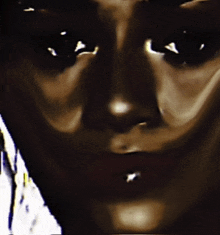 a close up of a person 's face with their eyes closed