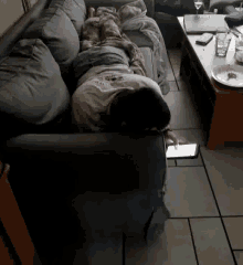 a person laying on a couch with a tablet