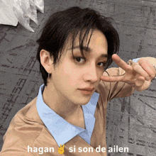 a close up of a person 's face with the words hagan si son de ailen written below it