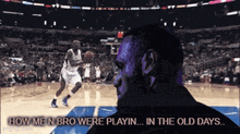 a man watching a basketball game with the words how me n bro were playin