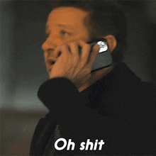 a man talking on a cell phone with the words oh shit written on the bottom
