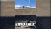 a picture of a person riding a bike on a bridge with the words val next week below it