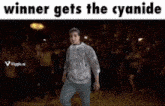 a man is dancing in front of a crowd with the words winner gets the cyanide above him