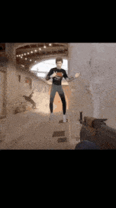 a man is jumping in the air in a video game with a gun behind him