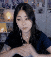 a woman wearing headphones and a tattoo on her arm