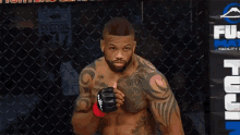 a man in a boxing ring with a sign that says fuji