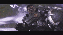 a man in armor is standing in front of a shield and a lightning bolt .