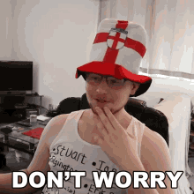 a man wearing a hat and glasses has the words " do n't worry " below him