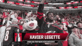 xavier legette is a carolina panthers wide receiver in the stands at a hockey game