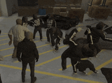 a group of people wearing skeleton hoodies are fighting in a parking lot