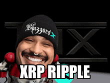 a man wearing a black beanie that says blazord x on it