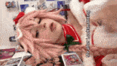 a girl in a santa costume is laying down and says me after looksmaxxing