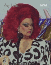 a woman with red hair and a very delta logo on the bottom