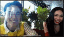 two women are smiling on a video call with the name mayward on the bottom right