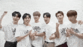 a group of young men are posing for a picture and one of their shirts says limited edition