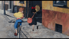 a girl with a broom is walking down a cobblestone street