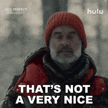 an advertisement for nine perfect strangers shows a man wearing a red hat and a black jacket