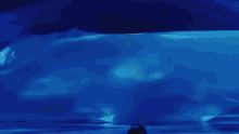 a painting of a person standing in front of a blue iceberg