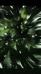 a man with glasses is standing in a dark room surrounded by a green background .