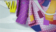 a close up of a purple and pink blanket