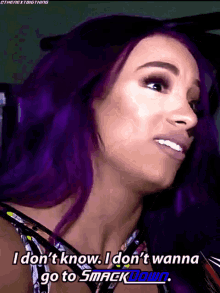 a woman with purple hair says i don t know i don t wanna go to smack down