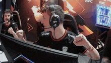 a man wearing headphones with syner written on his shirt
