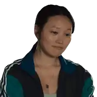 a woman wearing a necklace and a jacket with stripes on the sleeves