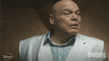 a man in a white suit with the word daredevil on the bottom